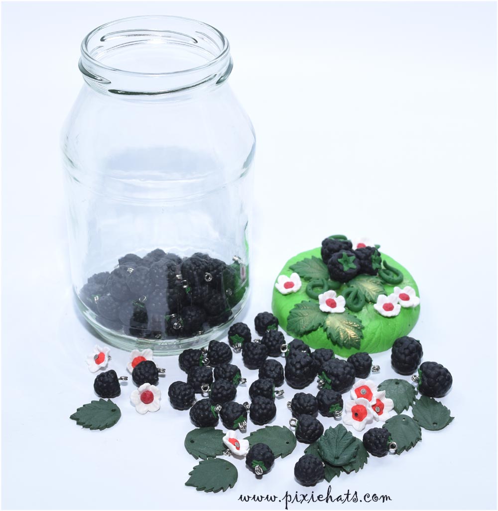 Polymer clay blackberry charms in decorated glass jar